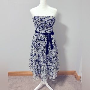 BCBG MazAzria strapless cocktail dress with sequin detail.